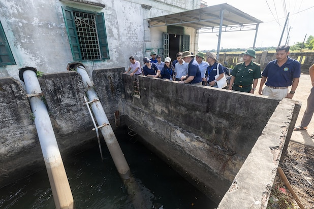 Servicemembers assigned to Pacific Partnership 2026 (PP26) and members of the Quang Tri Sub-department of Irrigation and Disaster Prevention visit Left-bank Le Ky River Dike System during a disaster management field training exercise in Quang Tri, Vietnam, July 2, 2026.