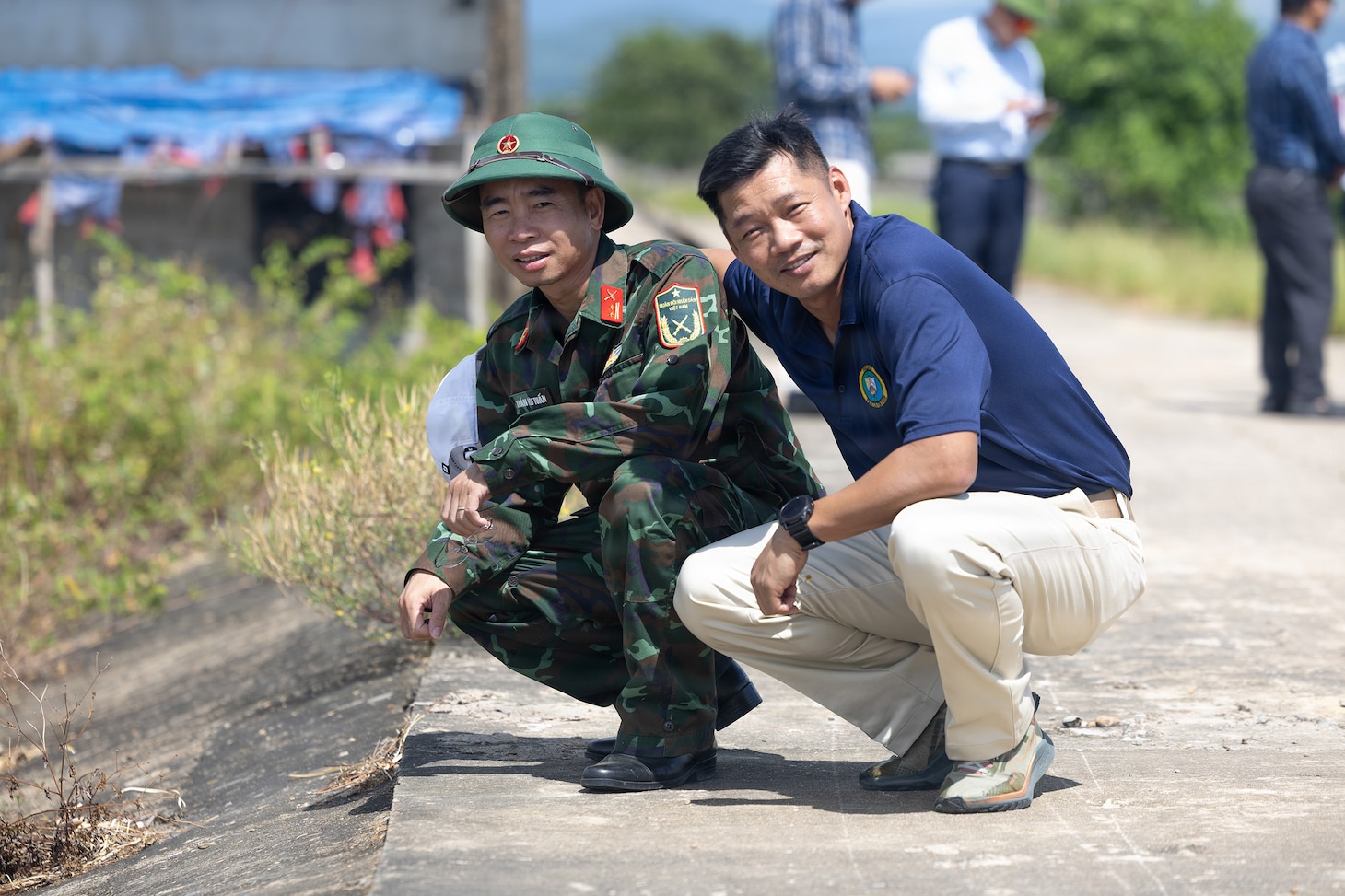 Vietnam People’s Armed Forces Lt. Col. Trần Hữu Tuấn, left, assigned to Quang Tri Provincial Military Command, poses for a photo with U.S. Army Master Sgt. Tony Dang, right, Civil Affairs team sergeant assigned to Pacific Partnership 2026 disaster management workshop during a PP26 disaster management field training exercise in Quang Tri, Vietnam, July 2, 2026.