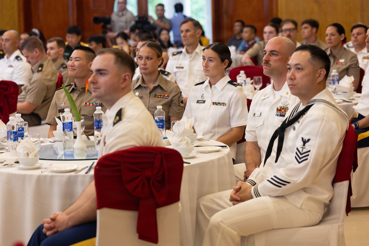 Members of Pacific Partnership 2026 (PP26), Pacific Friendship 2026 (PF26), and Vietnamese host nation representatives listen to remarks during the PP26 and PF26 joint closing ceremony in Quang Tri, Vietnam, July 3, 2026.