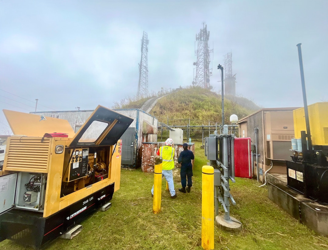 A U.S. Coast Guard team makes repairs to restore connectivity to the Mt. Alutom communications tower on Guam with a FEMA generator, improving VHF coverage in part of the region, on July 9, 2026. The towers on Rota and Saipan remain offline.  Additionally, the team at the Rota Emergency Operations Center informed the U.S. Coast Guard that the VHF tower on Saipan was damaged by Super Typhoon Bavi, further limiting near-shore VHF radio coverage. (U.S. Coast Guard photo)