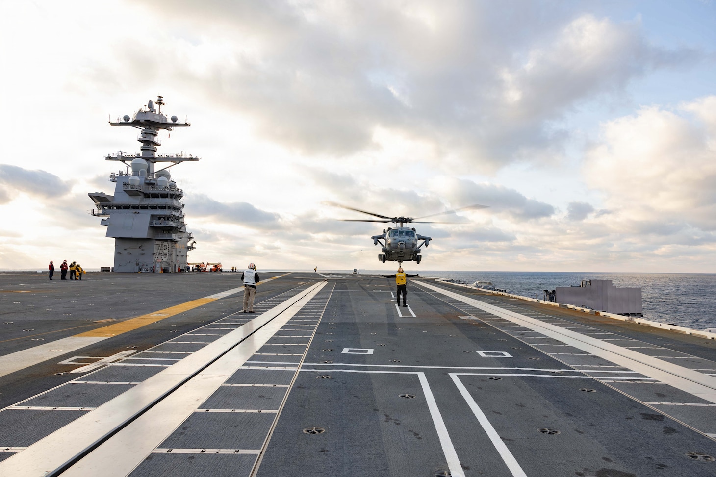 An MH-60S Seahawk helicopter, attached to the “Fleet Angels” of Helicopter Sea Combat Squadron (HSC) 2, lands on the flight deck of Pre-Commissioning Unit John F. Kennedy (CVN 79) during Builder’s Trials, Jan. 30, 2026. Builder’s Trials provide an opportunity to test ship systems and components at sea for the first time, and make required adjustments prior to additional underway testing.