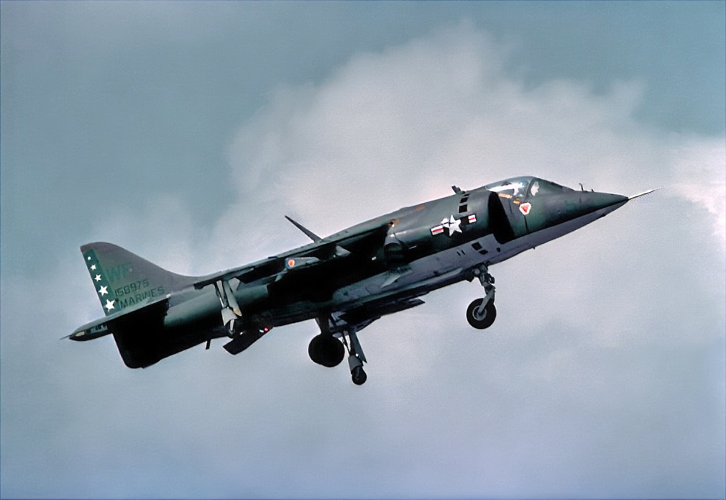 The AV-8C Harrier (Bureau Number 158975) on display at the museum pictured landing at Naval Air Station (NAS) Whiting Field, during its service in Marine Attack Squadron (VMA) 513.