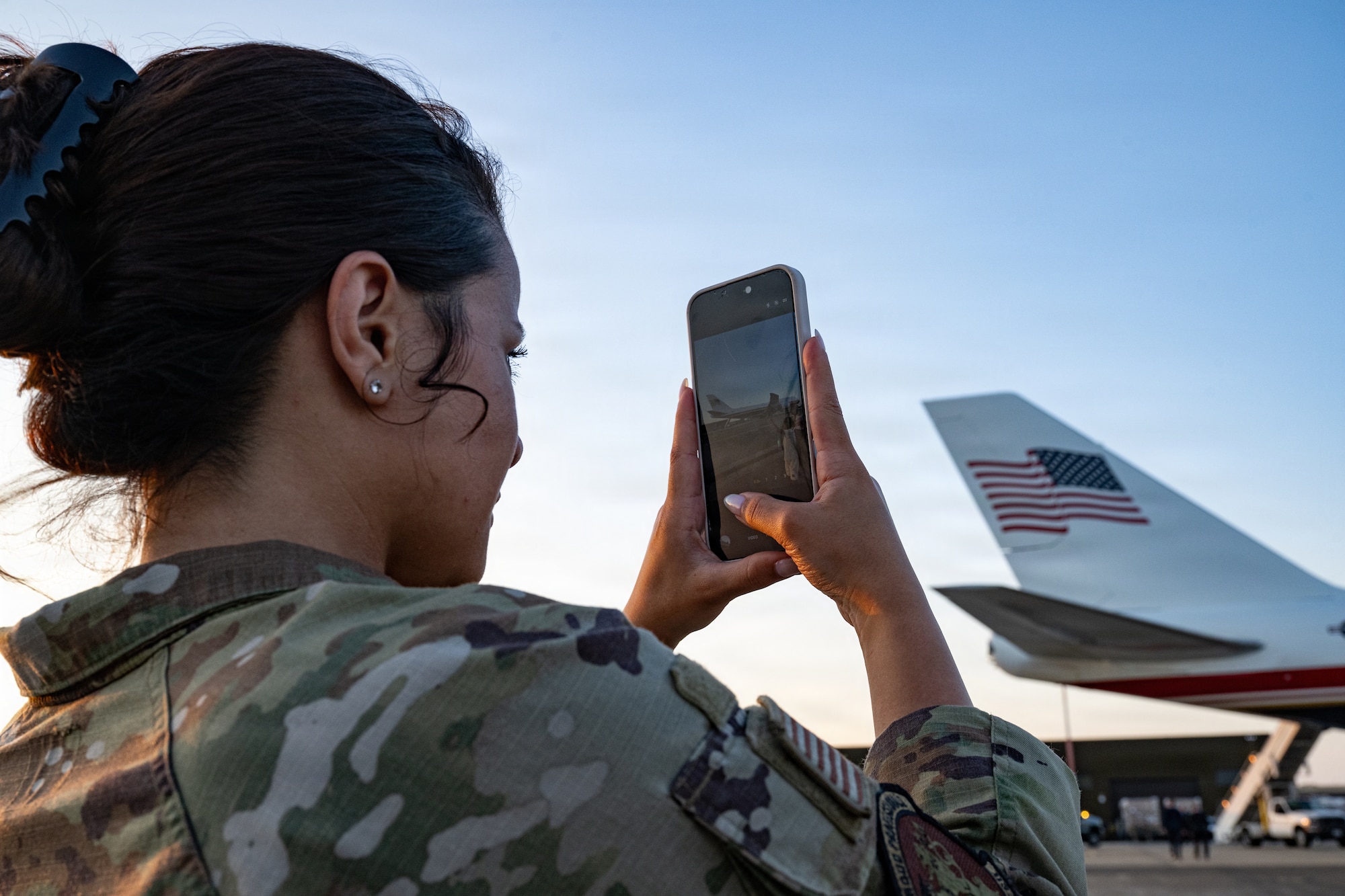 U.S. Air Force Senior Airman Francheska Marin, 100th Maintenance Squadron unit deployment manager, captures an image of the Air Force’s VC-25B Bridge aircraft at RAF Mildenhall, England, July 8, 2026.