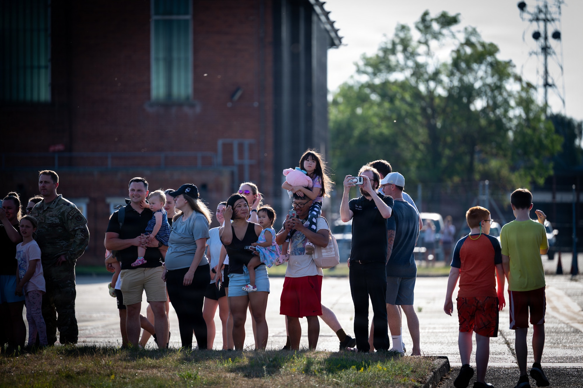 U.S. Airmen and their families gather to view the Air Force’s VC-25B Bridge aircraft on the flightline at RAF Mildenhall, England, July 8, 2026.