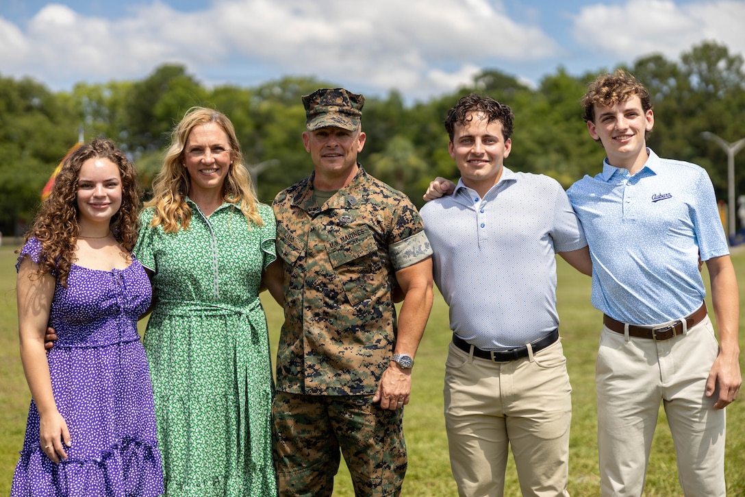 U.S. Marine Corps Sgt. Maj. Bryan M. Alfaro, out-going sergeant major, Marine Corps Air Station Beaufort, and his family pose for a photo during a Relief and Appointment Ceremony at MCAS Beaufort, South Carolina, July 1, 2026. The ceremony recognized Alfaro for his service, leadership and dedication to the unit while welcoming in-coming Sgt. Maj. Lacey J. Lewis. (U.S. Marine Corps photo by Cpl. Isabella Renaud)