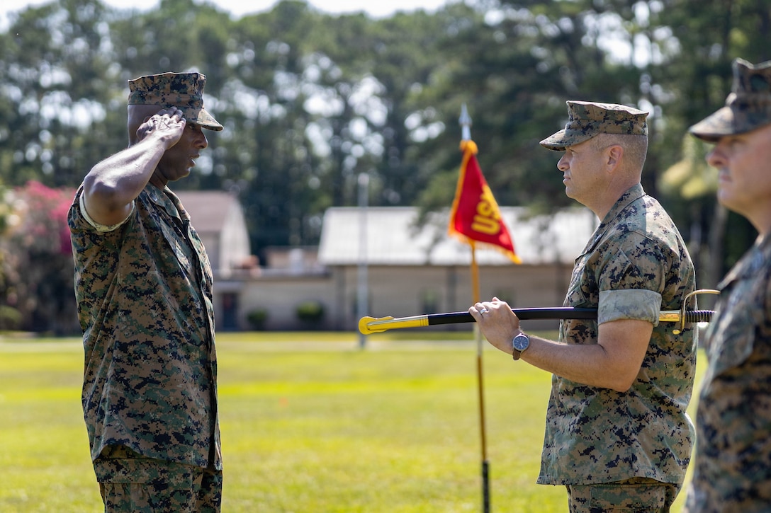 U.S. Marine Corps Sgt Maj. Lacey J. Lewis, in-coming sergeant major, Marine Corps Air Station Beaufort, left, salutes Col. Trevor J. Felter, commanding officer, MCAS Beaufort, during a Relief and Appointment Ceremony at MCAS Beaufort, South Carolina, July 1, 2026. The ceremony recognized Sgt. Maj. Bryan M. Alfaro, out-going sergeant major, MCAS Beaufort, for his service, leadership and dedication to the unit while welcoming Lewis. (U.S. Marine Corps photo by Cpl. Isabella Renaud)