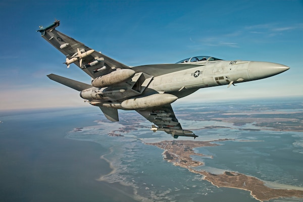 An F/A-18 conducts testing with the Small Diameter Bomb (SDB) II at Naval Air Station Patuxent River, Md. The SDB II variant includes an advanced tri-mode seeker, allowing it to engage dynamic targets in adverse conditions.