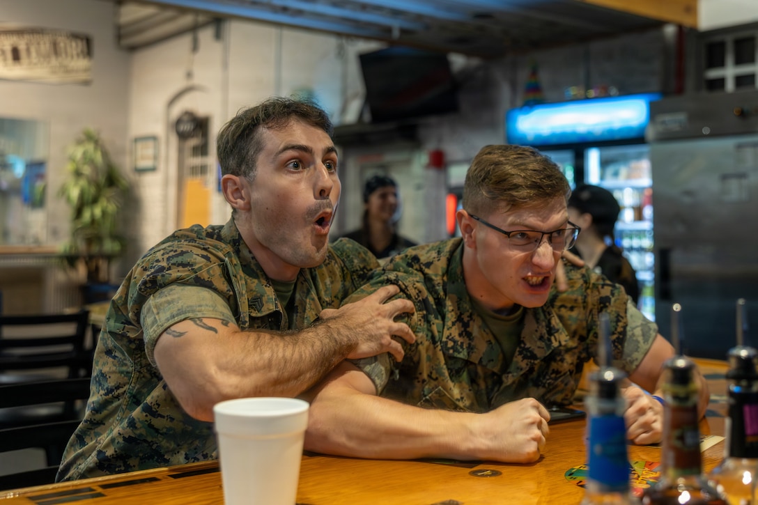 U.S. Marine Corps Sgt. David W. Foust, left, and Pfc. Damion L. Magel both flight equipment technicians with Marine Air Logistics Squadron 31, Marine Aircraft Group 31, 2nd Marine Aircraft Wing, celebrate during the FIFA World Cup 2026 watch party at Marine Corps Recruit Depot Parris Island, South Carolina, July 1, 2026. The watch party was hosted by Marine Corps Community Services and televised by FOX Sports to bolster comradery and moral within surrounding units. (U.S. Marine Corps photo by Lance Cpl. Carl J. Walters)