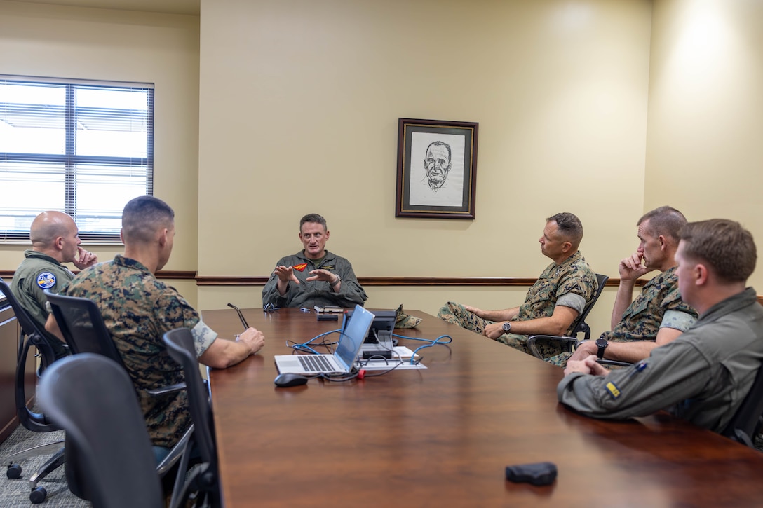 U.S. Marine Corps Brig. Gen. Patrick F. Tiernan, commanding general, 4th Marine Aircraft Wing, Marine Forces Reserve, speaks with leaders of Marine Corps Air Station Beaufort at MCAS Beaufort, South Carolina, July 7, 2026. During the visit, Tiernan engaged in discussions regarding the future of Marine Fighter Training Squadron 402, fleet adversary support, Reserve Component support to the Active Component, and toured hangars, facilities, and barracks.
