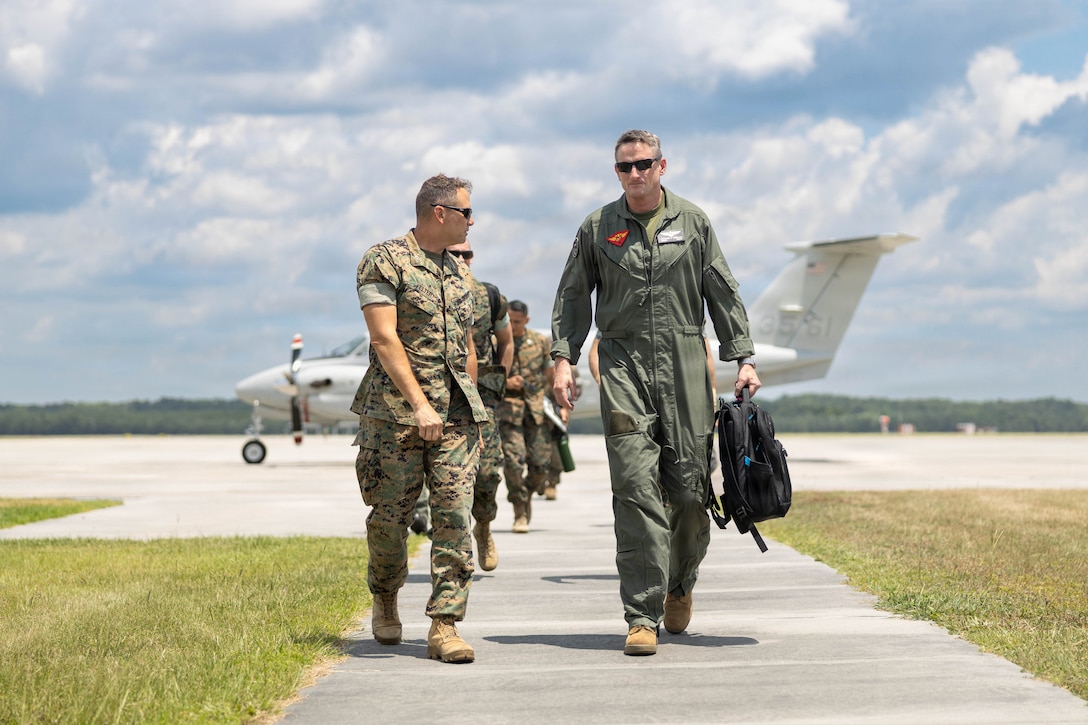 U.S. Marine Corps Col. Trevor Felter, commanding officer, Marine Corps Air Station Beaufort, left, speaks with Brig. Gen. Patrick Tiernan, commanding general, 4th Marine Aircraft Wing, Marine Forces Reserve, at MCAS Beaufort, South Carolina, July 7, 2026. During the visit, Tiernan engaged in discussions regarding the future of Marine Fighter Training Squadron 402, fleet adversary support, Reserve Component support to the Active Component, and toured hangars, facilities, and barracks.