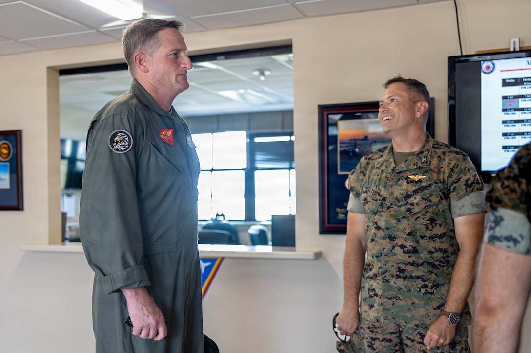 U.S. Marine Corps Brig. Gen. Patrick Tiernan, commanding general, 4th Marine Aircraft Wing, Marine Forces Reserve, right, speaks with Col. Trevor Felter, commanding officer, Marine Corps Air Station Beaufort, at MCAS Beaufort, South Carolina, July 7, 2026. During the visit, Tiernan engaged in discussions regarding the future of Marine Fighter Training Squadron 402, fleet adversary support, Reserve Component support to the Active Component, and toured hangars, facilities, and barracks.