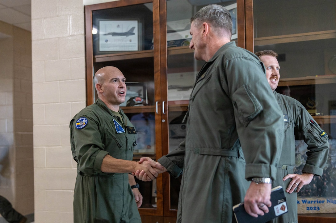 U.S. Marine Corps Col. Clayton D. Gard III, commanding officer, Marine Aircraft Group 31, 2nd Marine Aircraft Wing, left, greets Brig. Gen. Patrick F. Tiernan, commanding general, 4th Marine Aircraft Wing, Marine Forces Reserve, during a site visit at Marine Corps Air Station Beaufort, South Carolina, July 7, 2026. During the visit, Tiernan engaged in discussions regarding the future of Marine Fighter Training Squadron 402, fleet adversary support, Reserve Component support to the Active Component, and toured hangars, facilities, and barracks.