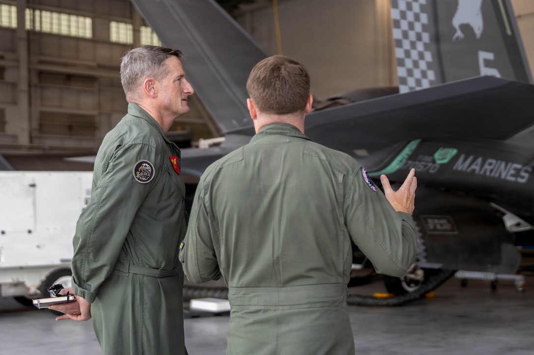 U.S. Marine Corps Brig. Gen. Patrick F. Tiernan, commanding general, 4th Marine Aircraft Wing, Marine Forces Reserve, left, speaks with Maj. Murphy B. Mosley, pilot, Marine Fighter Attack Squadron 533, Marine Aircraft Group 31, 2nd Marine Aircraft Wing, at Marine Corps Air Station Beaufort, South Carolina, July 7, 2026. During the visit, Tiernan engaged in discussions regarding the future of Marine Fighter Training Squadron 402, fleet adversary support, Reserve Component support to the Active Component, and toured the hangars, facilities, and barracks.