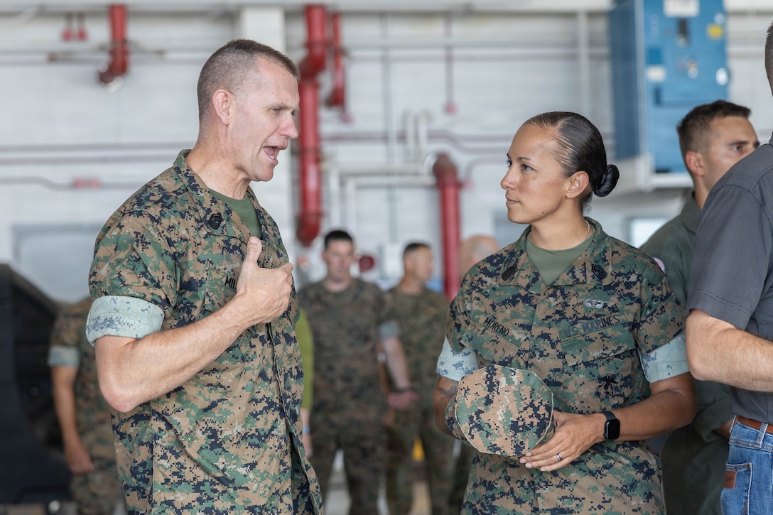 U.S. Marine Corps Sgt. Maj. Joshua K. Miller, sergeant major, 4th Marine Aircraft Wing, Marine Forces Reserve, left, speaks with Sgt. Maj. Mayra M. Moreno, sergeant major, Marine Aircraft Group 31, 2nd Marine Aircraft Wing, at Marine Corps Air Station Beaufort, South Carolina, July 7, 2026. During the visit, Brig. Gen. Patrick F. Tiernan, commanding general, 4th Marine Aircraft Wing, Marine Forces Reserve, engaged in discussions regarding the future of Marine Fighter Training Squadron 402, fleet adversary support, Reserve Component support to the Active Component, and toured hangars, facilities, and barracks.