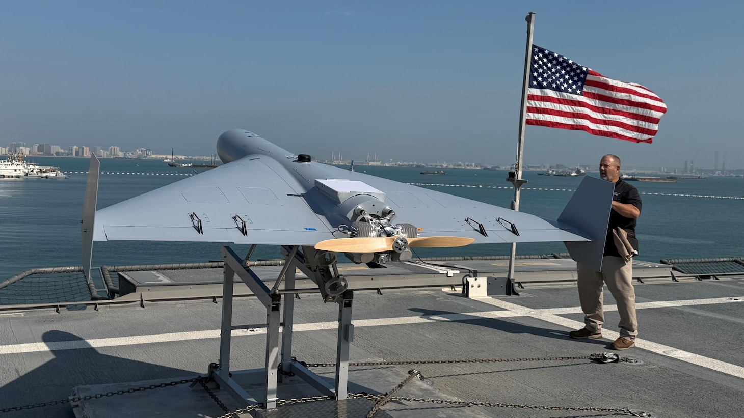 Nick Fancher, a Shipboard Weapons Integration Team weapons logistics analyst, and Rob Pavel, a logistician with Naval Air Warfare Center Weapons Division, conduct shipboard weapons integration work in support of the Low-cost Unmanned Combat Attack System aboard USS Santa Barbara (LCS 32). SWIT validates that weapons systems can be safely stored, moved, and handled at sea prior to operational use. LUCAS later successfully launched from the ship’s flight deck Dec. 16, 2025, as part of Task Force Scorpion Strike operations while operating in the Arabian Gulf.