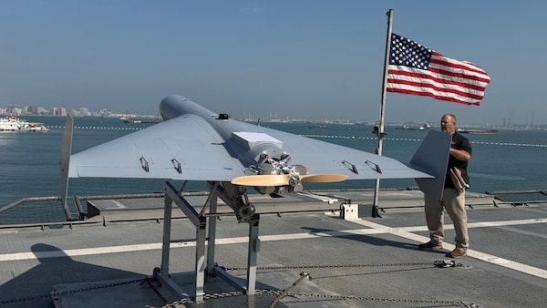Nick Fancher, a Shipboard Weapons Integration Team weapons logistics analyst, and Rob Pavel, a logistician with Naval Air Warfare Center Weapons Division, conduct shipboard weapons integration work in support of the Low-cost Unmanned Combat Attack System aboard USS Santa Barbara (LCS 32). SWIT validates that weapons systems can be safely stored, moved, and handled at sea prior to operational use. LUCAS later successfully launched from the ship’s flight deck Dec. 16, 2025, as part of Task Force Scorpion Strike operations while operating in the Arabian Gulf.