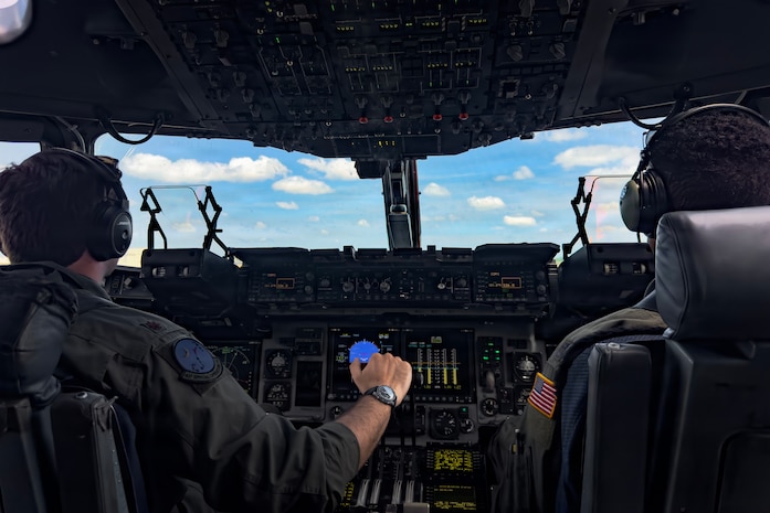 A photo of a pilot flying a C-17 Globemaster III cargo plane