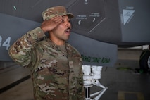 airmen salutes during change of command