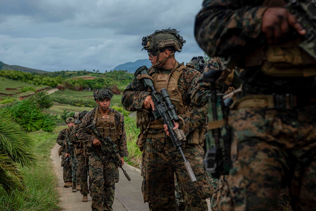 U.S. Marines assigned to 3rd Littoral Combat Team, 3rd Marine Littoral Regiment, 3rd Marine Division, and Philippine marines assigned to 4th Marine Brigade, patrol through terrain while participating in military operations in urban terrain training during maritime key terrain security operations in support of KAMANDAG 10 at Itbayat, Batanes islands, Philippines, June 24, 2026. KAMANDAG 10 is a multi-domain, joint, and combined exercise between the Armed Forces of the Philippines and United States military focused on enhancing maritime security, interoperability, contested logistics, and combined readiness throughout the Philippine archipelago. (U.S. Marine Corps photo by Sgt.  Iyer Ramakrishna)