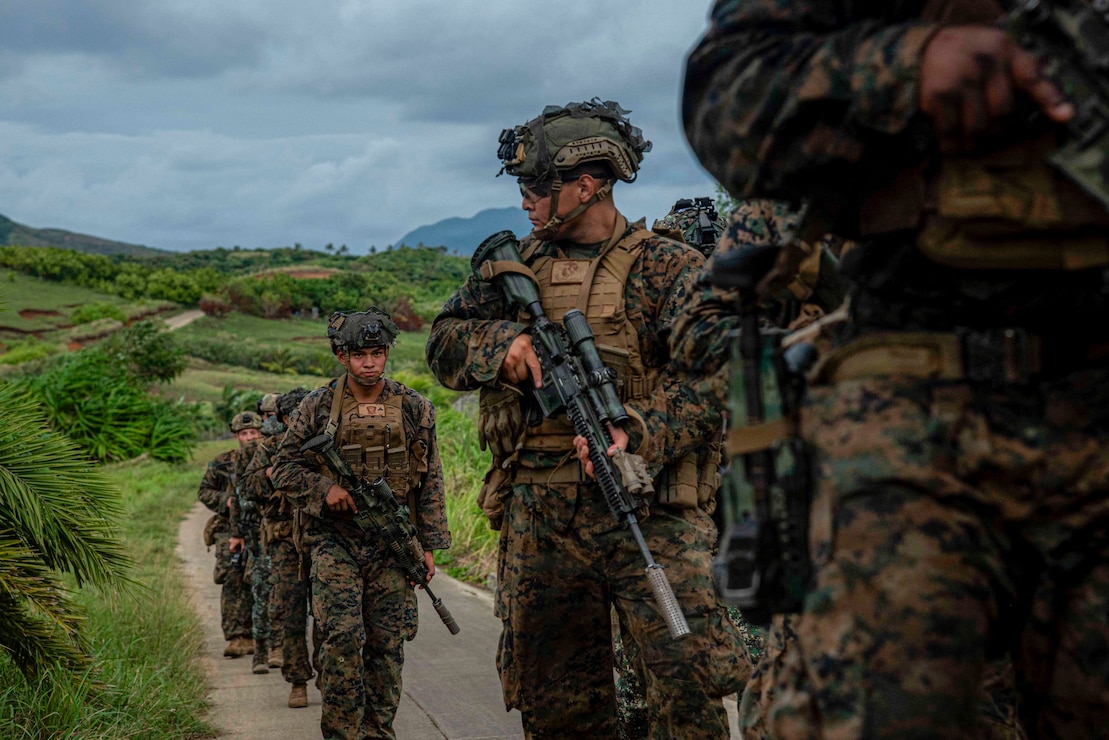 U.S. Marines assigned to 3rd Littoral Combat Team, 3rd Marine Littoral Regiment, 3rd Marine Division, and Philippine marines assigned to 4th Marine Brigade, patrol through terrain while participating in military operations in urban terrain training during maritime key terrain security operations in support of KAMANDAG 10 at Itbayat, Batanes islands, Philippines, June 24, 2026. KAMANDAG 10 is a multi-domain, joint, and combined exercise between the Armed Forces of the Philippines and United States military focused on enhancing maritime security, interoperability, contested logistics, and combined readiness throughout the Philippine archipelago. (U.S. Marine Corps photo by Sgt.  Iyer Ramakrishna)