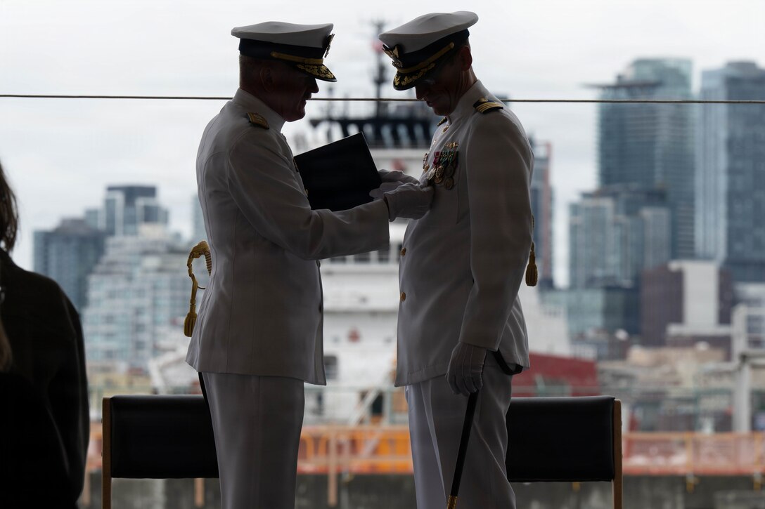 Coast Guard Capt. Jeffrey J. Rasnake is awarded the meritorious service medal during the USCGC Polar Star's (WAGB 10) change of command ceremony at U.S. Coast Guard Base Seattle, June 29, 2026. Rasnake served as the cutter's commanding officer since July 2024. (U.S. Coast Guard photo by Petty Officer 3rd class Adrian Sanchez Villa)