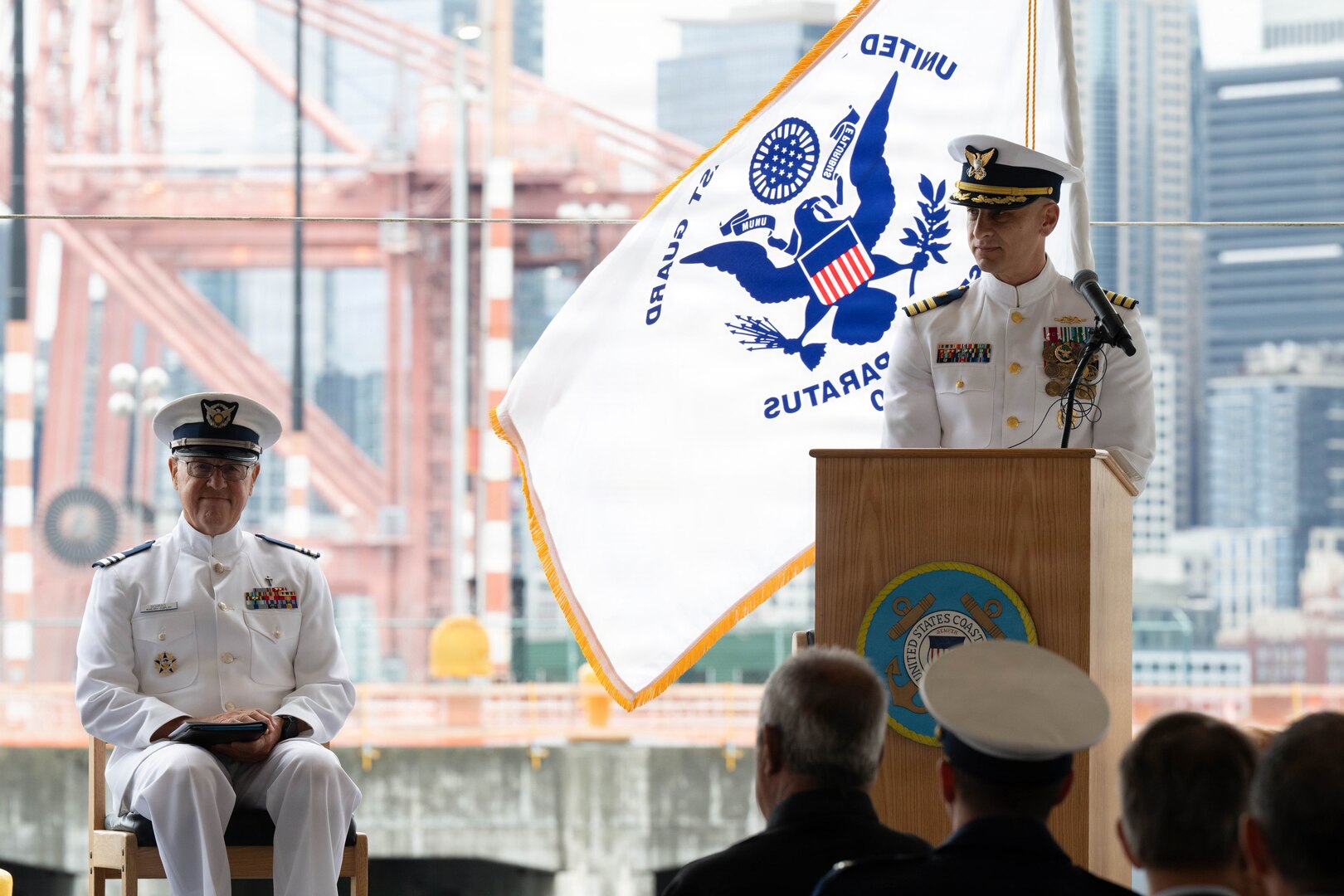 Coast Guard Cmdr. Samuel Blase provides remarks as emcee during USCGC Polar Star's (WAGB 10) change-of-command ceremony at U.S. Coast Guard Base Seattle, June 29, 2026. Capt. Justin O. Vanden Heuvel assumed command of the Polar Star from Capt. Jeffrey J. Rasnake during the cutter's change of command ceremony (U.S. Coast Guard photo by Petty Officer 3rd Class Adrian Sanchez Villa)
