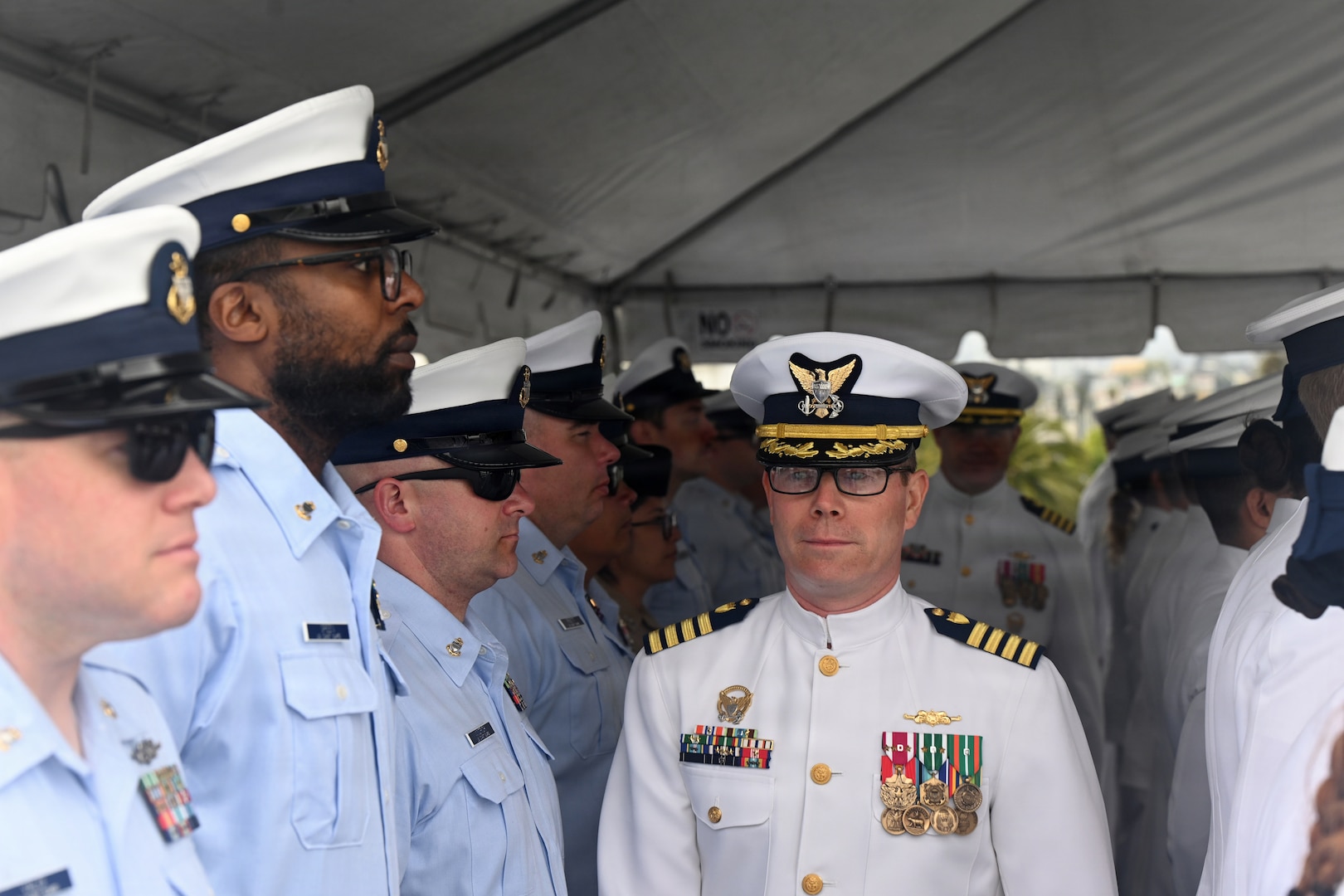 U.S. Coast Guard Capt. Tyson J. Scofield, U.S. Coast Guard Cutter Waesche’s (WMSL 751) outgoing commanding officer, inspects the crew during the cutter’s change-of-command ceremony at Coast Guard Island in Alameda, California, July 9, 2026. The change-of-command ceremony is a time honored tradition that formally transfers authority, responsibility, and accountability from one commanding officer to another. (U.S. Coast Guard photo by Petty Officer 3rd Class Danish Khan.)