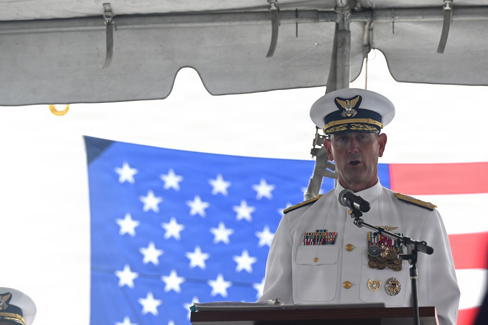 U.S. Coast Guard Vice Adm. Joseph R. Buzzella gives a speech during the USCGC Waesche’s (WMSL 751) change-of-command ceremony at Coast Guard Island in Alameda, California, July 9. 2026. Buzella presided over the ceremony in which Capt. Dave W. Ratner relieved Capt. Tyson J. Scofield as Waesche’s commanding officer. (U.S. Coast Guard photo by Petty Officer 3rd Class Danish Khan.)