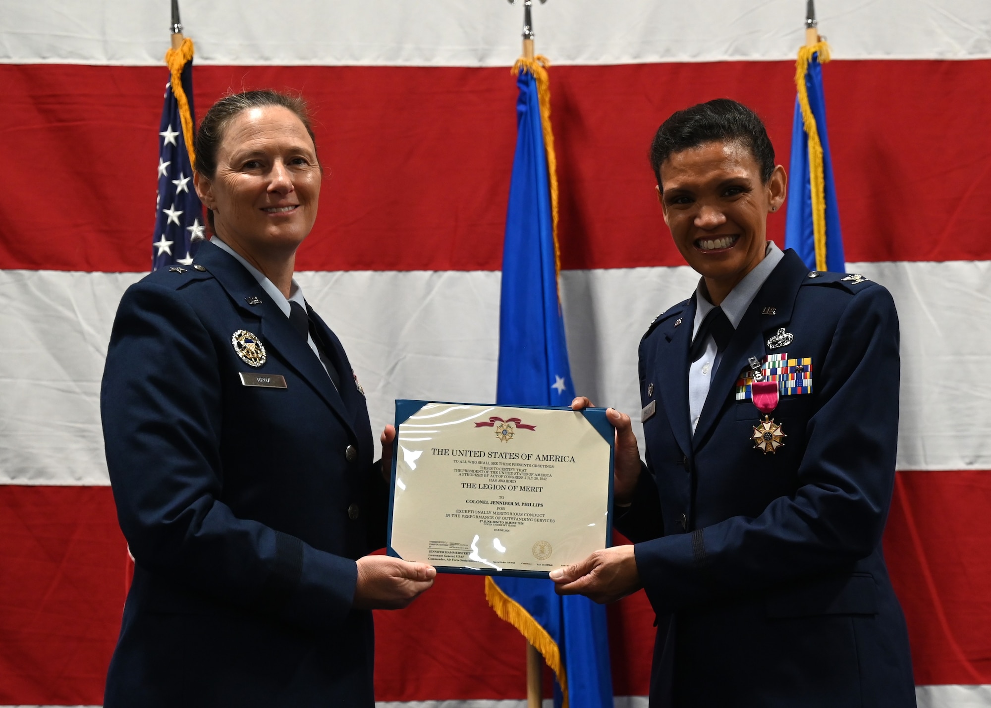Two people hold a certificate