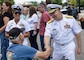 Rear Adm. David Faehnle, commandant of Naval District Washington, interacts with civilians, during SAIL250 Maryland & Airshow Baltimore.