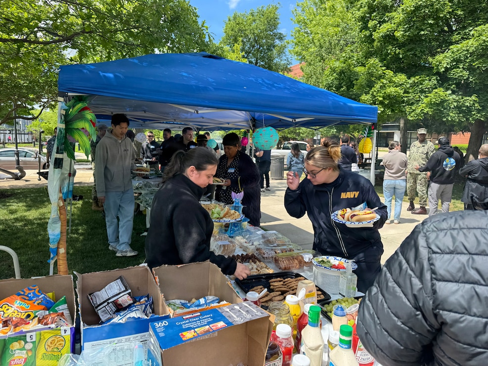 Naval District Washington teammates gather at Willard Park on the Washington Navy Yard for the command picnic.