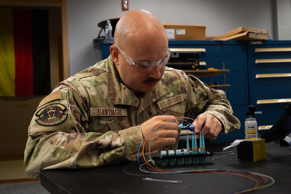 Senior Airman Eric Santiago troubleshoots radio equipment.