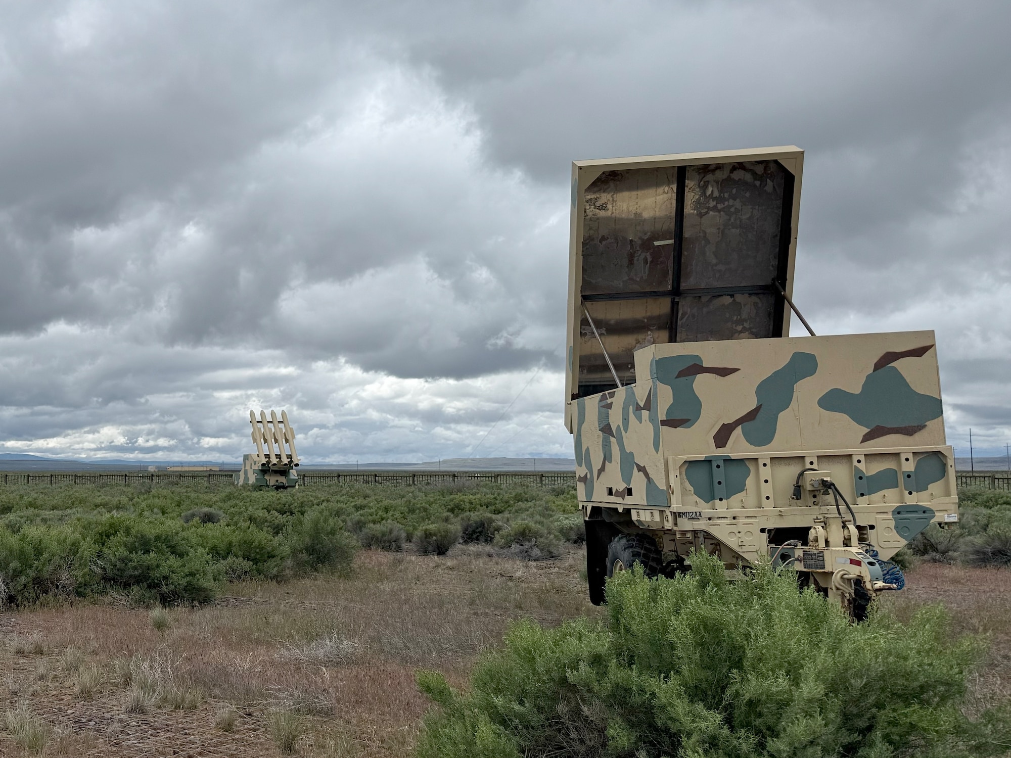 Metal targets are parked in a field