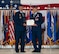 U.S. Air Force Col. Jesse Lamarand, 5th Bomb Wing (BW) outgoing commander, right, receives the Legion of Merit certificate from U.S. Air Force Maj. Gen. Ty Neuman, 8th Air Force and Joint-Global Strike Operations Center commander, left, during a change of command ceremony at Minot Air Force Base, North Dakota, July 9, 2026. As the 5th BW commander, Lamarand directed over 6,000 military and civilian personnel across the wing’s four groups, and was responsible for ensuring the combat readiness of the wing's B-52H Stratofortress fleet, providing long-range strike and strategic deterrence capabilities worldwide. (U.S. Air Force photo by Airman 1st Class Anthony Ramey)