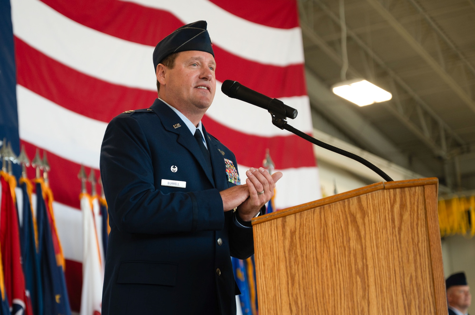 U.S. Air Force Col. John Burrell, 5th Bomb Wing (BW) incoming commander, gives remarks during a change of command ceremony at Minot Air Force Base, North Dakota, July 9, 2026. As the incoming commander, Burrell is responsible for leading the 5th BW’s B-52H Stratofortress operations and ensuring the wing remains ready to provide global strike capabilities in support of Air Force Global Strike Command’s strategic deterrence mission. (U.S. Air Force photo by Airman 1st Class Anthony Ramey)