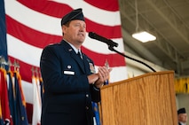 U.S. Air Force Col. John Burrell, 5th Bomb Wing (BW) incoming commander, gives remarks during a change of command ceremony at Minot Air Force Base, North Dakota, July 9, 2026. As the incoming commander, Burrell is responsible for leading the 5th BW’s B-52H Stratofortress operations and ensuring the wing remains ready to provide global strike capabilities in support of Air Force Global Strike Command’s strategic deterrence mission. (U.S. Air Force photo by Airman 1st Class Anthony Ramey)