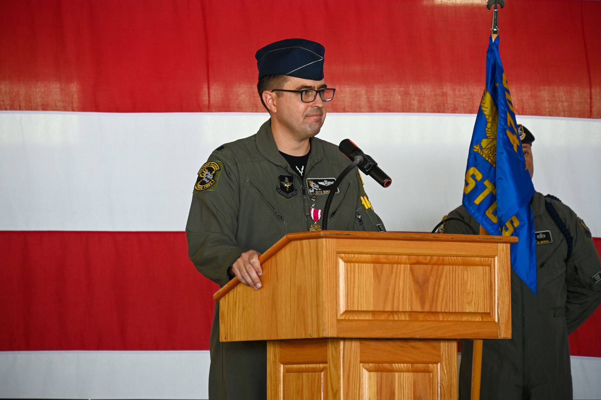 U.S. Air Force Lt. Col. Aaron Borszich, 47th Student Squadron (STUS) outgoing commander, delivers remarks during the 47th STUS change of command ceremony at Laughlin Air Force Base, Texas, July 10, 2026. Change of command ceremonies represent a formal transfer of authority and responsibility of a unit from one commanding officer to another. (U.S. Air Force photo by Airman 1st Class Kylie Rabb)