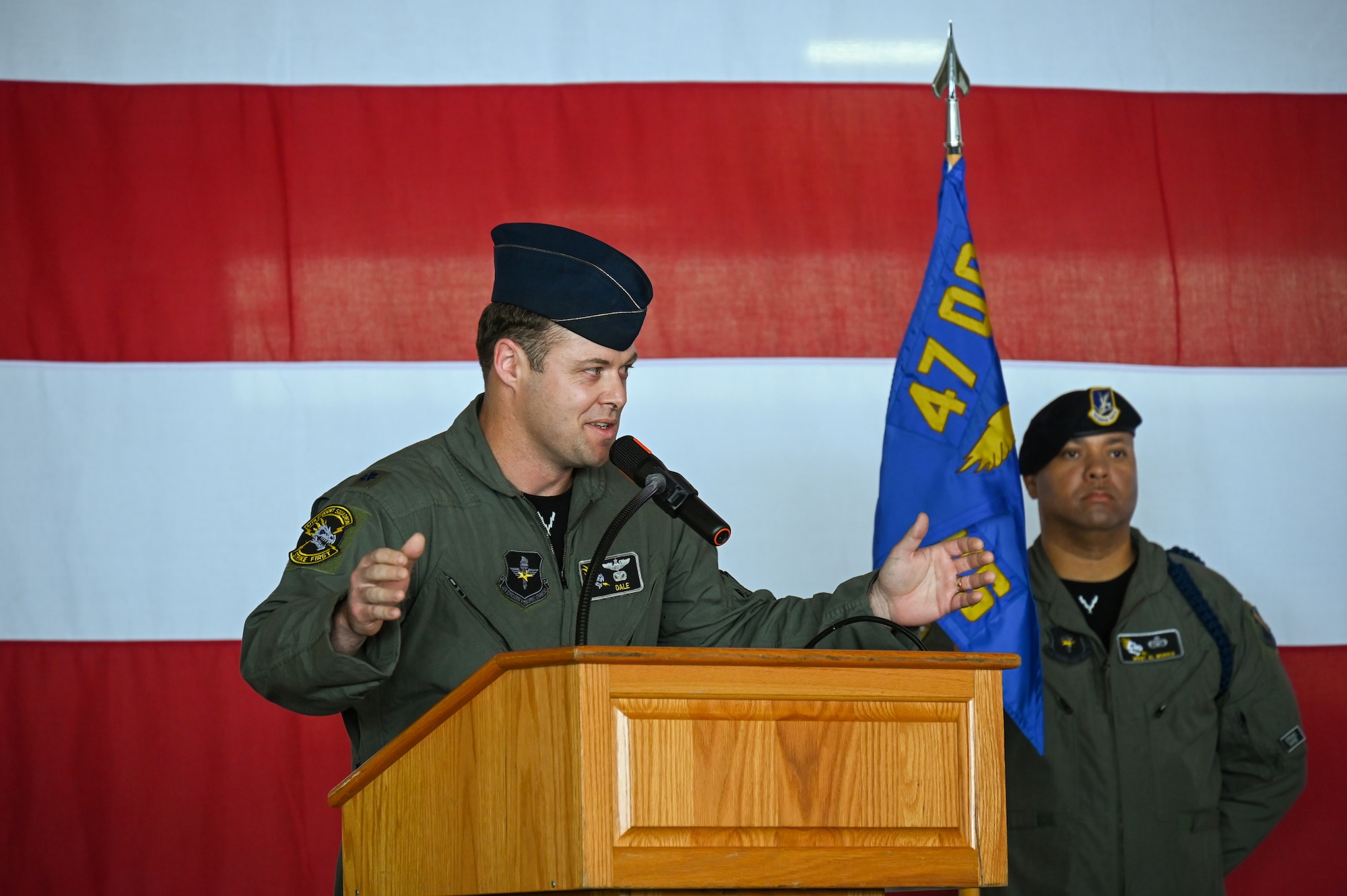 U.S. Air Force Lt. Col. Aaron Borszich, 47th Student Squadron (STUS) incoming commander, delivers remarks during the 47th STUS change of command ceremony at Laughlin Air Force Base, Texas, July 10, 2026. Change of command ceremonies represent a formal transfer of authority and responsibility of a unit from one commanding officer to another. (U.S. Air Force photo by Airman 1st Class Kylie Rabb)
