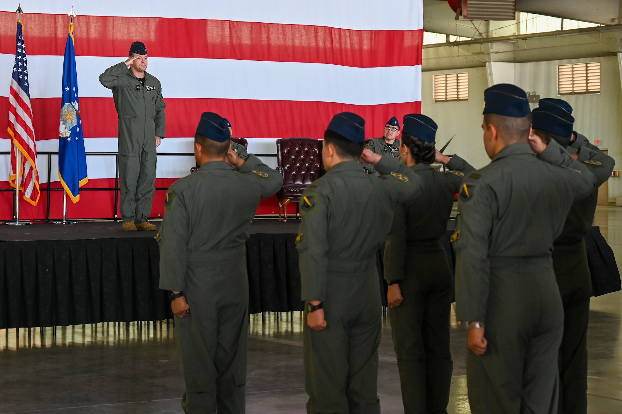 U.S. Air Force Lt. Col. Dane Coppini, 47th Student Squadron (STUS) incoming commander, renders a first salute to his squadron during the 47th STUS change of command ceremony at Laughlin Air Force Base, Texas, July 10, 2026. Change of command ceremonies represent a formal transfer of authority and responsibility of a unit from one commanding officer to another. (U.S. Air Force photo by Airman 1st Class Kylie Rabb)