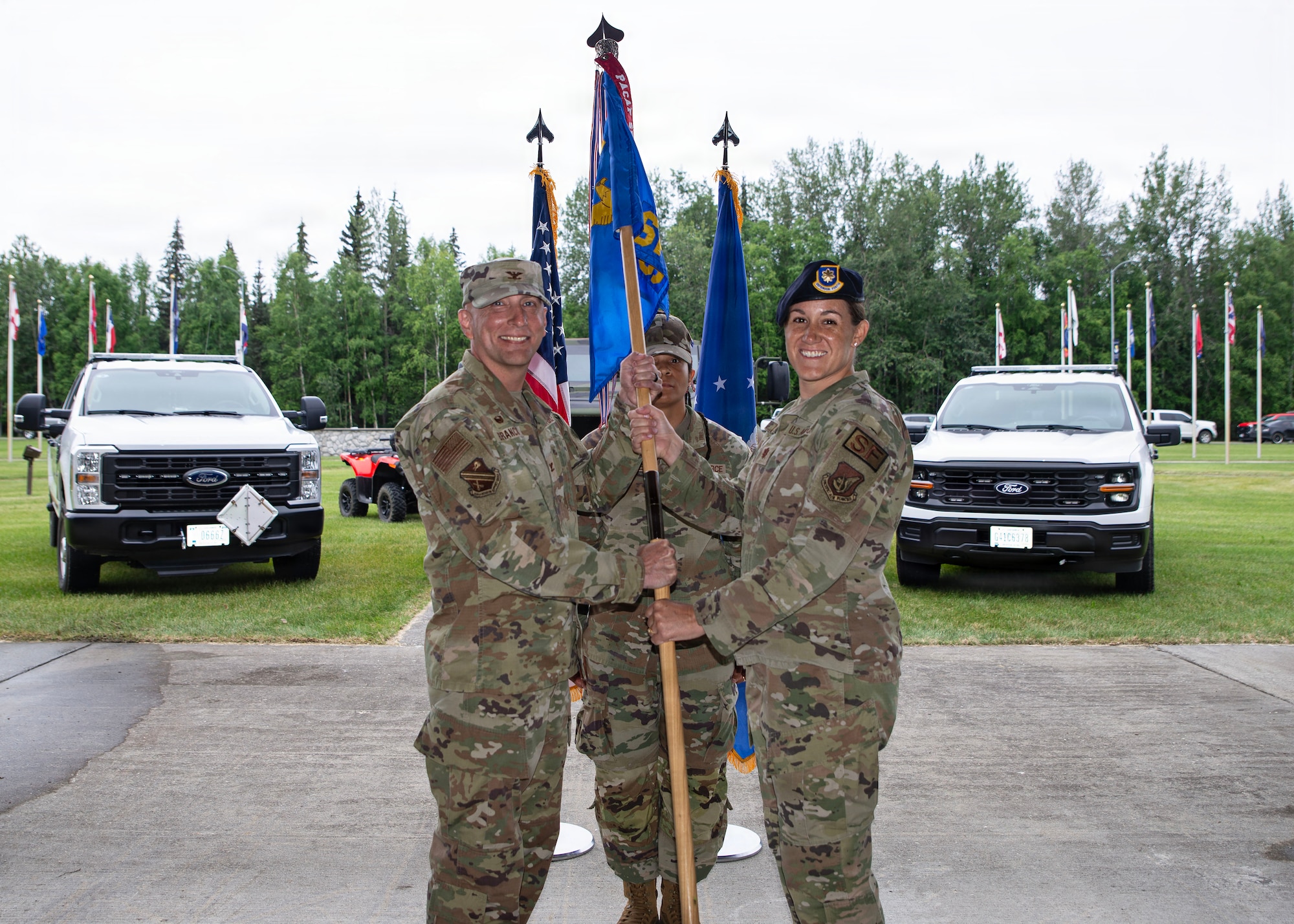 U.S. Air Force Maj. Emily Smith, right, assumes command of the 354th Security Forces Squadron from U.S. Air Force Col. Allen Branco, 354th Mission Support Group commander, during an assumption of command ceremony at Eielson Air Force Base, Alaska, July 10, 2026.