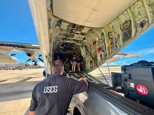 A U.S. Coast Guard dive team from the Regional Dive Locker in Honolulu arrives in Saipan, aboard an HC-130J Hercules airplane deployed from U.S. Coast Guard Air Station Barbers Point, to address affected aids to navigation in the Commonwealth of the Northern Mariana Islands on July 10, 2026. U.S. Coast Guard crews continue to assess and rectify discrepancies to aids to navigation, waterways, and channel conditions across the Marianas following Super Typhoon Bavi. (U.S. Coast Guard photo by Lt. Gabe LaMartina)