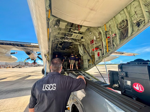 A U.S. Coast Guard dive team from the Regional Dive Locker in Honolulu arrives in Saipan, aboard an HC-130J Hercules airplane deployed from U.S. Coast Guard Air Station Barbers Point, to address affected aids to navigation in the Commonwealth of the Northern Mariana Islands on July 10, 2026. U.S. Coast Guard crews continue to assess and rectify discrepancies to aids to navigation, waterways, and channel conditions across the Marianas following Super Typhoon Bavi. (U.S. Coast Guard photo by Lt. Gabe LaMartina)