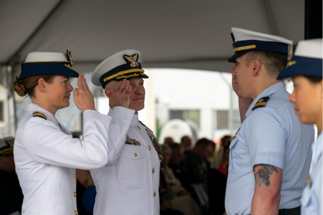 Capt. Ginny Nadolny, the incoming Coast Guard Sector Southeast Alaska commander, left, and Capt. Stanley Fields, the departing sector commander, inspect the sector honor platoon during a change of command ceremony at Coast Guard Station Juneau, Alaska, July 10, 2026.