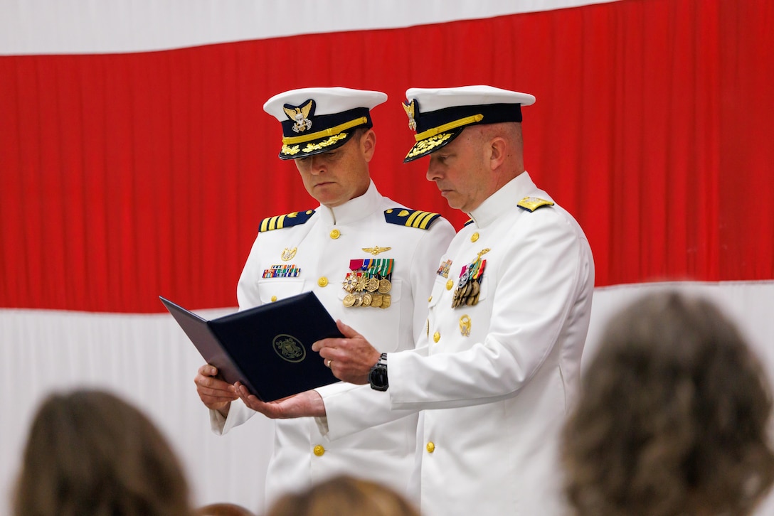 Coast Guard Cmdr. Joseph Semke, left, outgoing commanding officer of Coast Guard Air Station Sitka, is presented with the Coast Guard Meritorious Service Medal by Rear Adm. Ralph Little, right, commander of Coast Guard Arctic District, as part of the air station’s change-of-command ceremony in Sitka, Alaska, July 10, 2026. Semke received the medal for his service as the air station’s commanding officer from June 2024 to July 2026. 

(Courtesy photo by Auxiliarist Don Kluting)