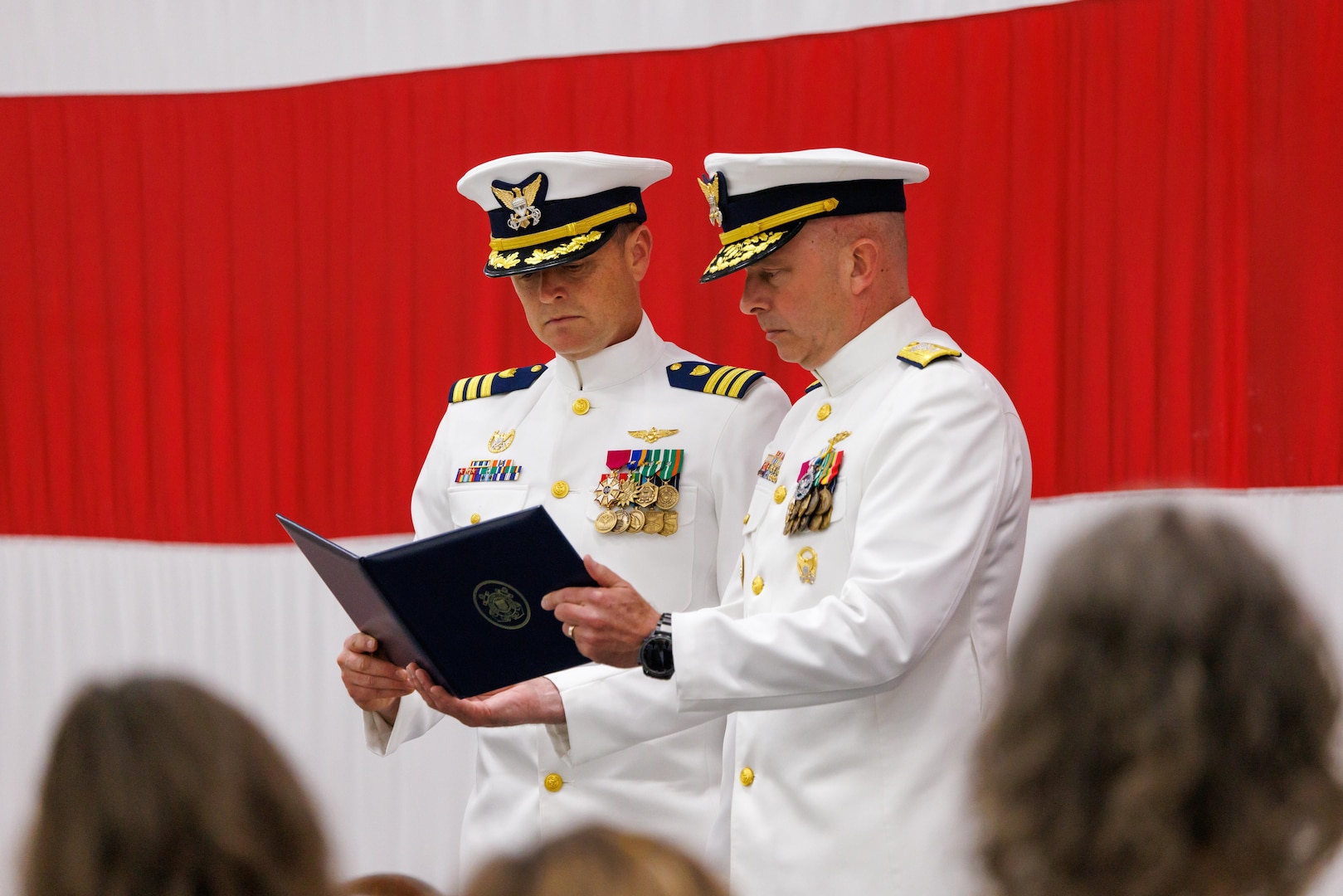 Coast Guard Cmdr. Joseph Semke, left, outgoing commanding officer of Coast Guard Air Station Sitka, is presented with the Coast Guard Meritorious Service Medal by Rear Adm. Ralph Little, right, commander of Coast Guard Arctic District, as part of the air station’s change-of-command ceremony in Sitka, Alaska, July 10, 2026. Semke received the medal for his service as the air station’s commanding officer from June 2024 to July 2026. 

(Courtesy photo by Auxiliarist Don Kluting)