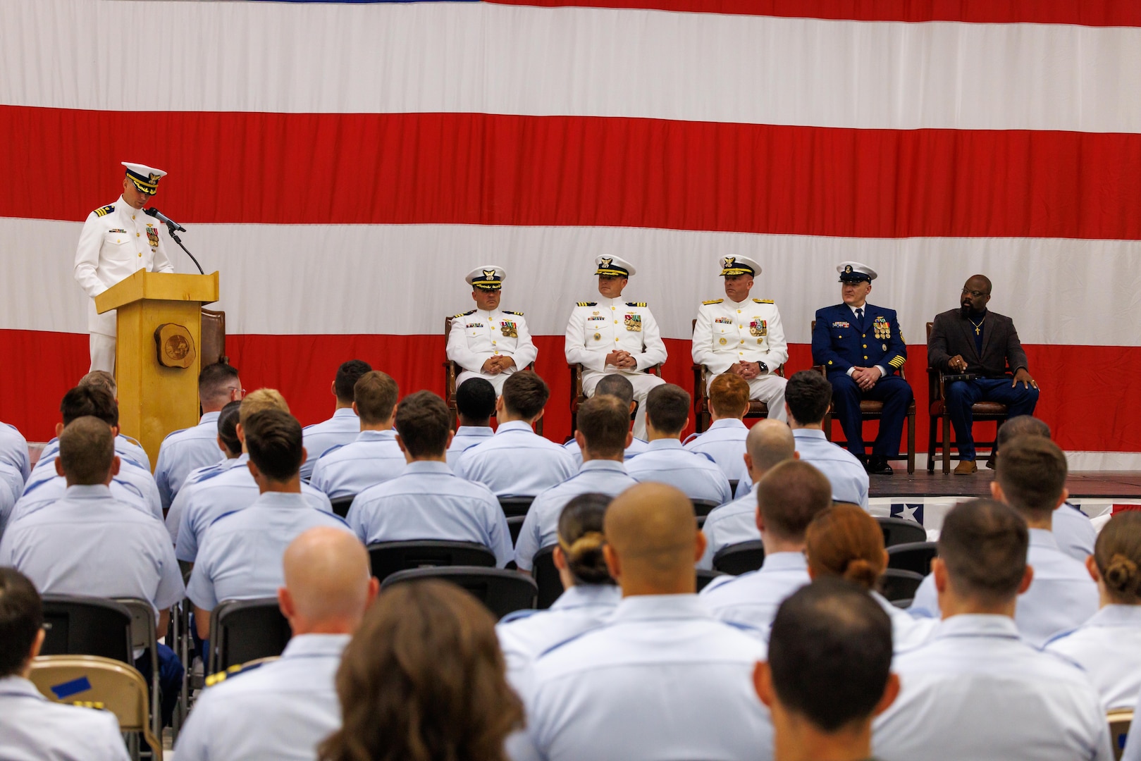 Coast Guard Cmdr. Wesley Jones, executive officer of Coast Guard Air Station Sitka, speaks at the change-of-command ceremony of the air station in Sitka, Alaska, July 10, 2026. A change-of-command ceremony is a time-honored tradition that represents the passing of authority from one commanding officer to the next. 

(Courtesy photo by Auxiliarist Don Kluting)