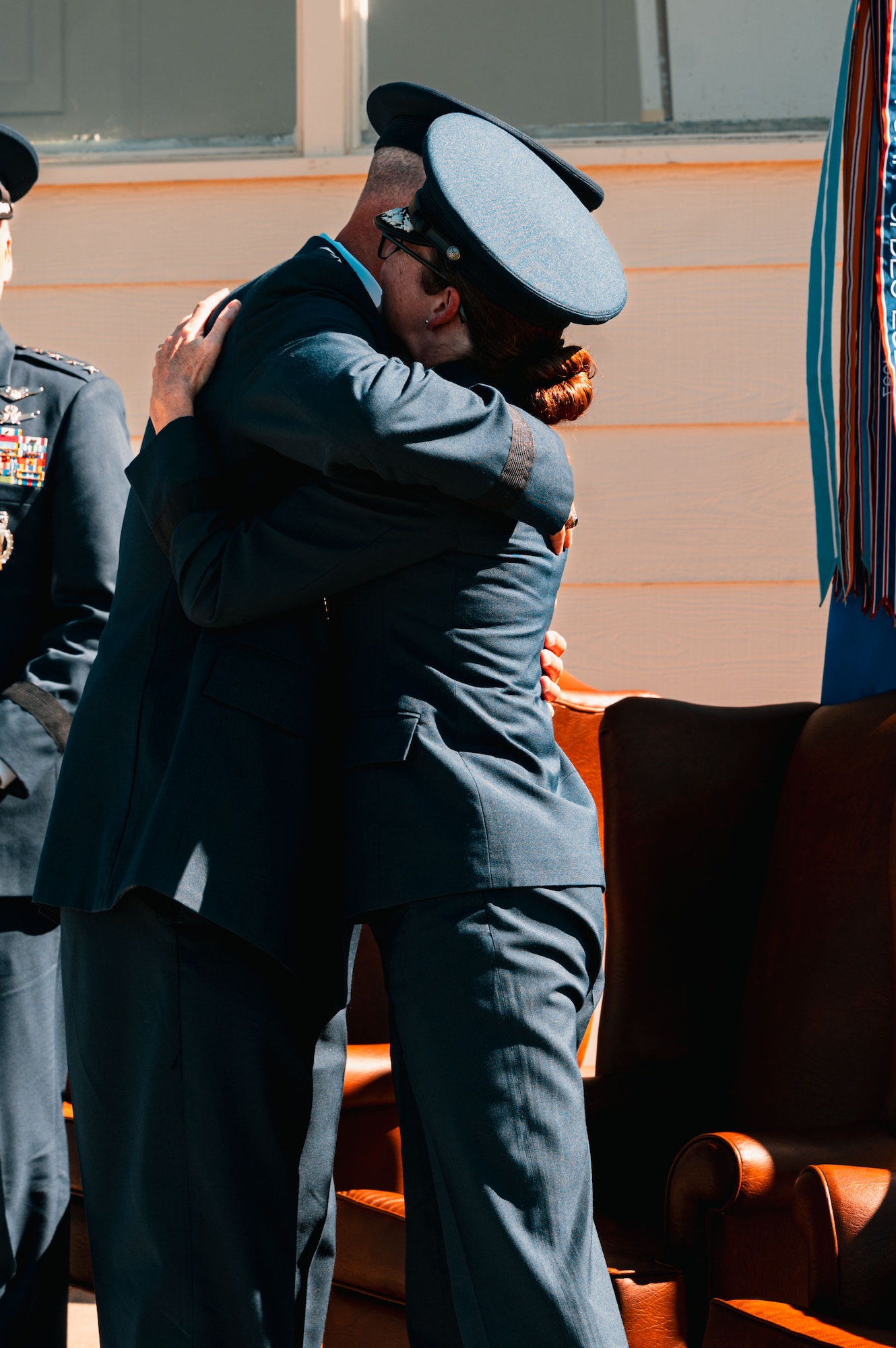 Maj. Gen. Stacy Jo Huser, outgoing 20th Air Force commander, congratulates Maj. Gen. Colin Connor, incoming 20th AF commander, during the 20th AF change of command at F.E. Warren Air Force Base, Cheyenne, Wyoming, July 10, 2026. The change of command ceremony formally transferred leadership and responsibility of the Numbered Air Force from the outgoing commander to the incoming commander while honoring the unit's continued commitment to mission success.(U.S. Air Force photo by Senior Airman Mattison Cole)