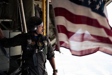 U.S. Air Force Tech. Sgt. Robert Hutton, 37th Airlift Squadron instructor loadmaster, assists Green Berets assigned to U.S. Special Operations Command Europe during a high-altitude, low-opening jump in Baumholder, Germany, July 4, 2026. Training with special operations forces strengthens interoperability between mobility and special operations units for global contingency operations. (U.S. Air Force photo by Senior Airman Edgar Grimaldo)