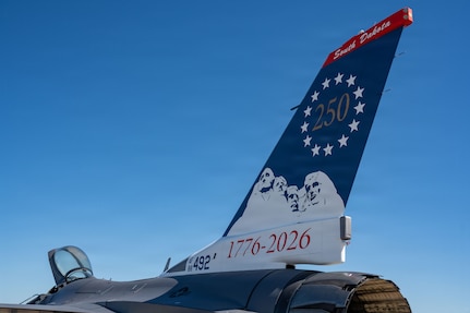 The starboard side of a heritage tail design is displayed on an F-16 Fighting Falcon assigned to the 175th Fighter Squadron, South Dakota Air National Guard, at Joe Foss Field in Sioux Falls, S.D., June 12, 2026. The design honors America’s 250th anniversary with 13 Betsy Ross stars representing the original colonies, a silhouette of Mount Rushmore, the numeral 250, and the years 1776-2026. (U.S. Air National Guard photo by Master Sgt. Luke Olson)