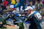 Tech. Sgt. Brandon Clement, right, a Team Air Force competitor, prepares to fire his rifle during the air precision competition at the Warrior Games in San Antonio, Texas, June 19, 2026. The games celebrate the determination, strength, and resilience of wounded, ill, and injured service members and veterans. (U.S. Air Force photo by Tech. Sgt. Shawn White)